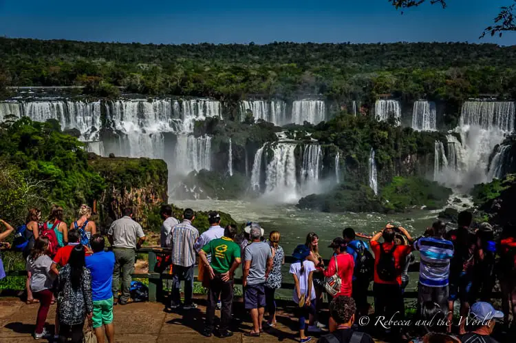 Should you visit Iguazu Falls Argentina or Brazil side? I say both! Read on for a guide on how to see both sides of the waterfalls, how to get here and where to stay. | #argentina #brazil #iguazufalls #nature #travelguide #waterfalls #puertoiguazu #fozdoiguazu #naturalwonders