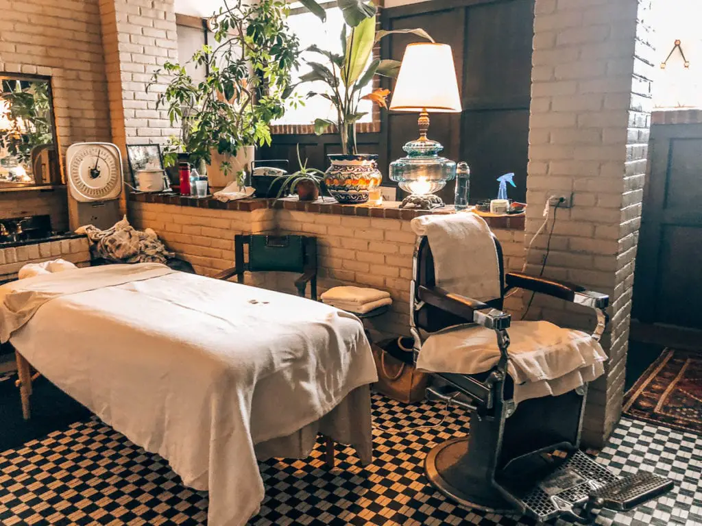 Interior of a health club in Detroit featuring a massage table and vintage decor. The Schvitz Health Club is one of the places in Detroit that only locals know about - but it should be on your Detroit itinerary!