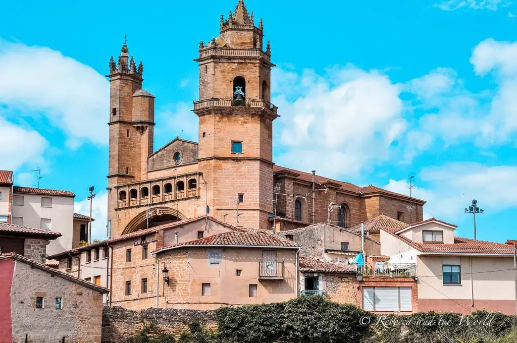 The majestic Cathedral of Santo Domingo de la Calzada with its two spired towers, nestled among the rustic buildings of La Rioja. You'll find plenty of gorgeous Spanish architecture in the La Rioja wine region.