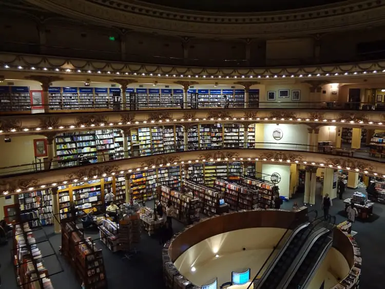 The interior of El Ateneo Grand Splendid, a former theater turned into a bookstore in Buenos Aires, with bookshelves across multiple levels around the central stage area. Regularly voted as one of the most beautiful bookstores in the world, El Ateneo Grand Splendid should be on your list of things to do in Buenos Aires, Argentina.