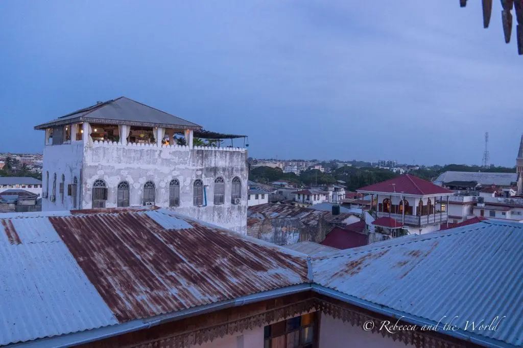 A rooftop view of a city at dusk, with buildings and the fading light in the sky. The Emerson Spice Hotel's Tea House Restaurant has great views over the city.