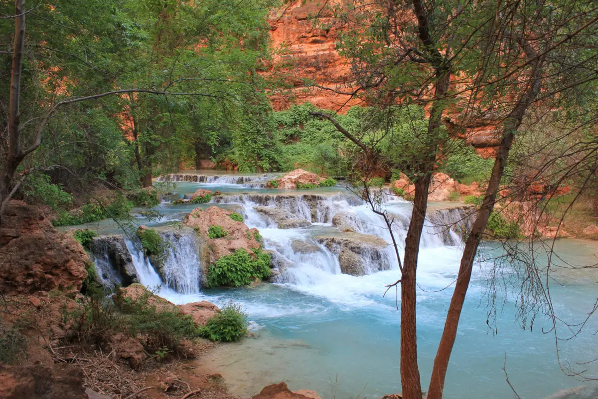 One of the most beautiful places to visit in America is Havasupai Falls - you'll need to plan well ahead to reserve permits