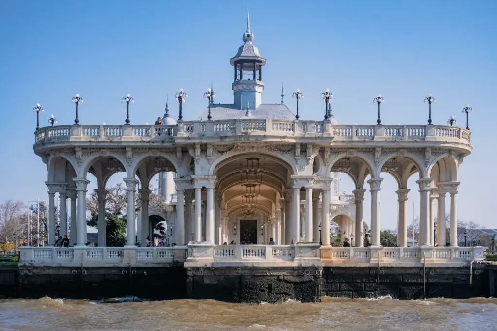 A classical-style pavilion with elaborate columns and arches, standing on a pier over a body of water in Tigre, Buenos Aires.