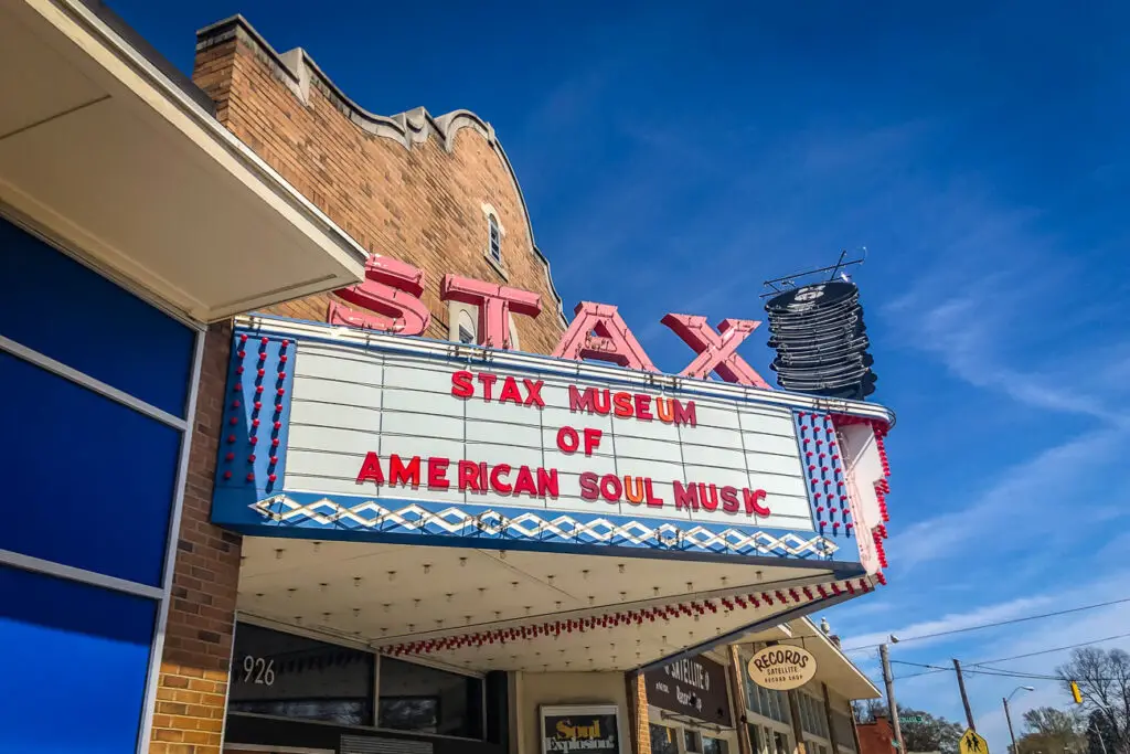 Facade of the 'STAX Museum of American Soul Music' with a brightly lit marquee sign and a vintage exterior.