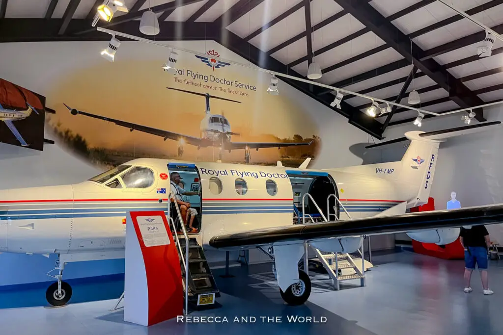 An exhibit at the Royal Flying Doctor Service museum, showing a small aircraft with open doors inside a hangar-like space. This museum visit is one of the educational Darwin attractions that offers insight into the region’s medical history, ideal for those researching what to do in Darwin.