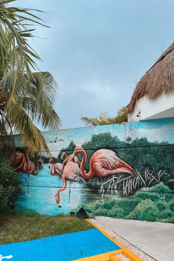 Vibrant mural of flamingos in Celestún, a popular stop on a Yucatan itinerary known for its wildlife and natural beauty.