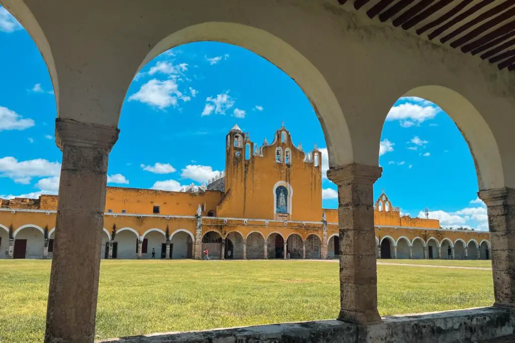 View of the iconic yellow Convento de San Antonio de Padua in Izamal, a great day trip from Merida option.