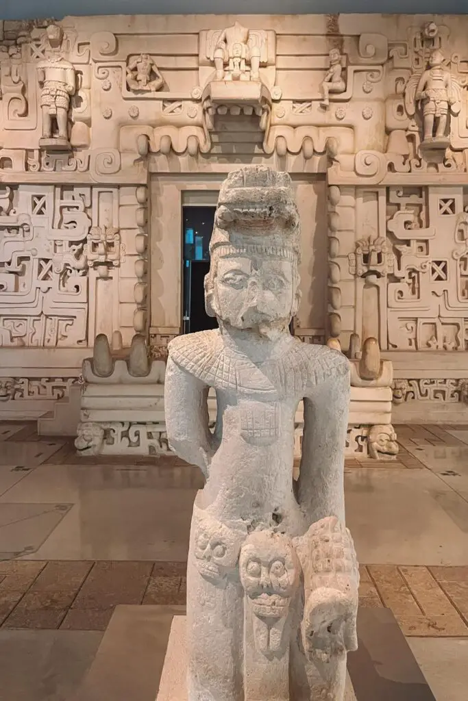 Mayan statue and intricate reliefs inside the Gran Museo del Mundo Maya in Merida, offering insight into the region’s Mayan history.