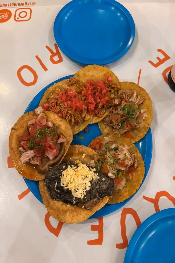 Colorful plate of assorted Yucatecan tacos from Taquería de la Unión in Merida - a great place to eat in Merida.