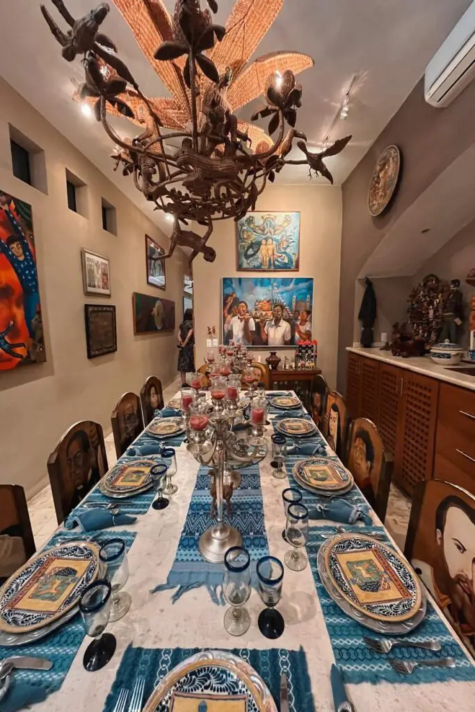 Eclectic dining room at Casa de los Venados in Valladolid, filled with Mexican folk art, one of the most interesting things to do in Valladolid.