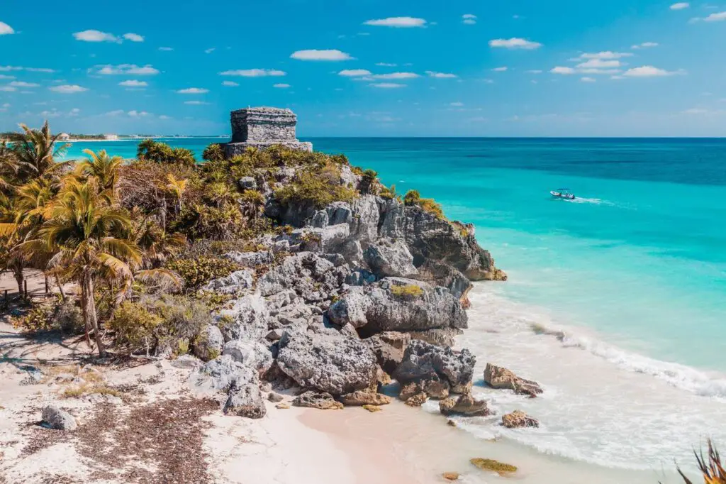 Scenic view of the Tulum ruins overlooking the turquoise Caribbean Sea, an iconic destination on any Yucatan itinerary.