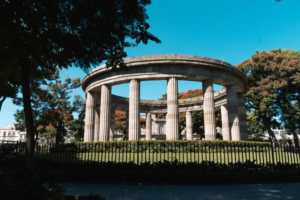 The Rotonda de los Jaliscienses Ilustres, a circular monument surrounded by columns and trees, honoring notable figures from Jalisco—an iconic site in Guadalajara’s historic center.