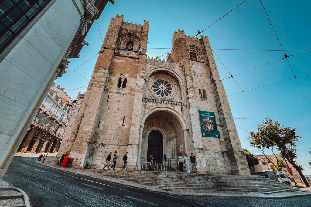 Exterior of Lisbon Cathedral (Sé de Lisboa), with its twin towers and arched entrance – a historic landmark to include in your 2-day Lisbon itinerary.