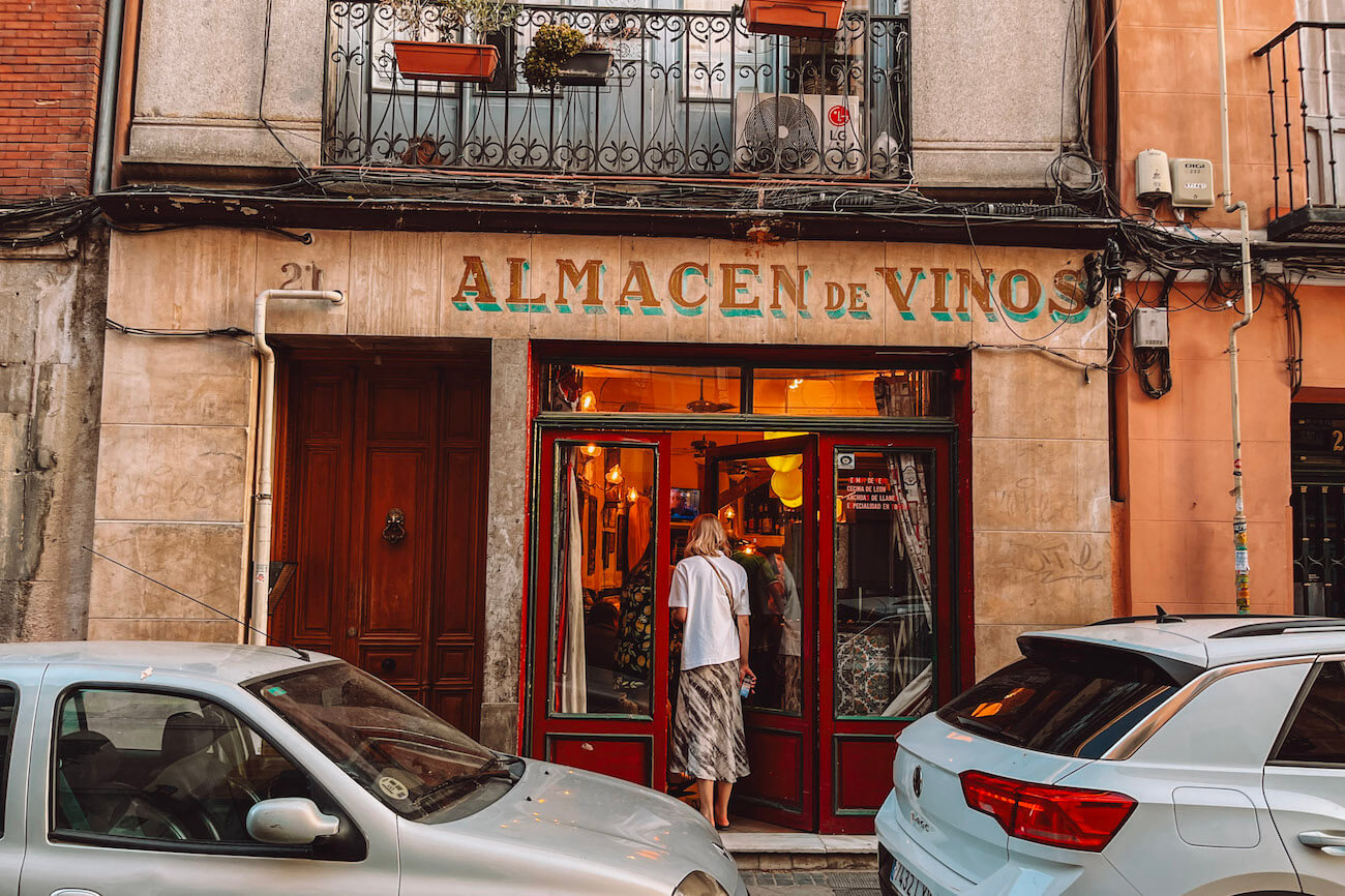 Traditional wine bar with a vintage sign reading Almacén de Vinos in central Madrid, a charming stop to include on a weekend in Madrid itinerary.