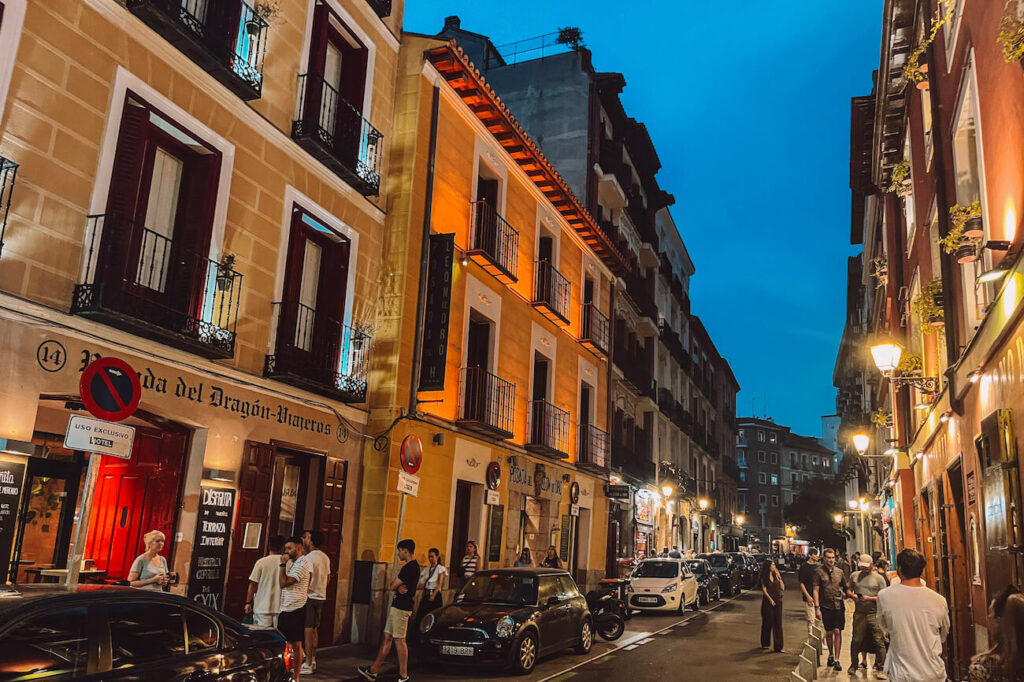 Evening street scene in Madrid’s city centre with lively bars and people socialising – a great way to experience the nightlife on a 2-day Madrid itinerary. This is Calle de la Cava Baja, otherwise known as Tapas Street - it's full of great restaurants.