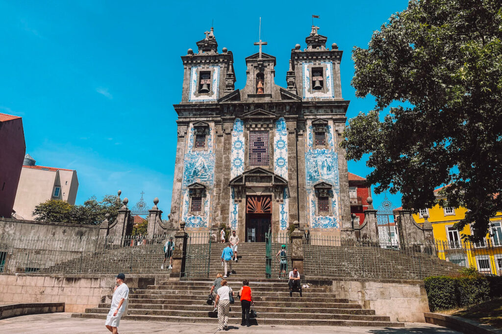 Igreja de Santo Ildefonso in Porto, featuring twin bell towers and azulejo-covered façade – a beautiful landmark worth visiting during two days in Porto.