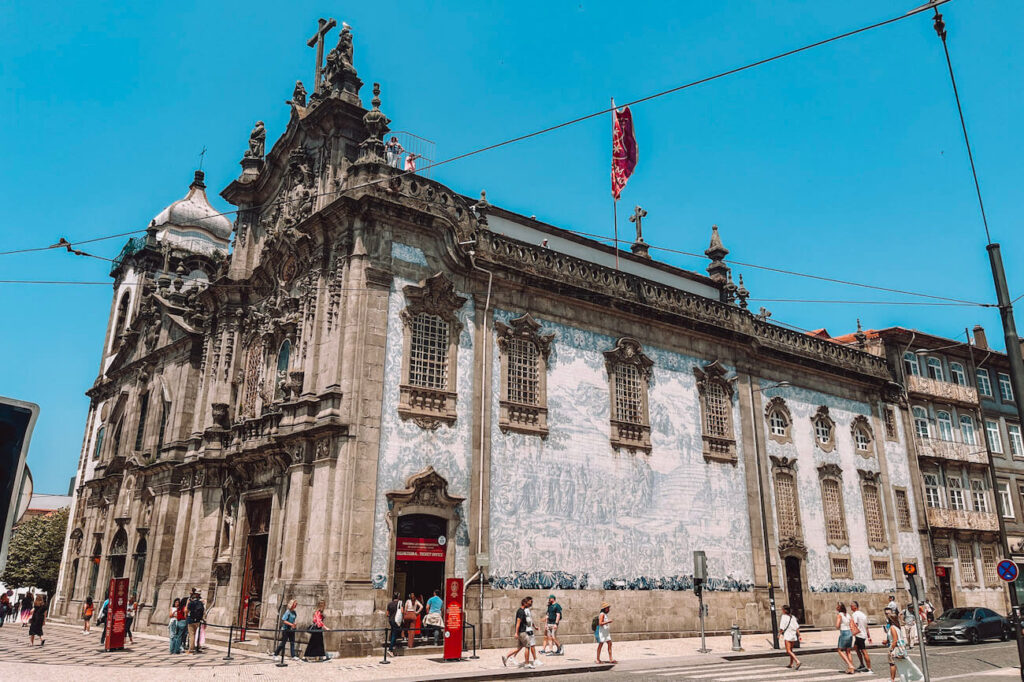 Ornate exterior of Igreja do Carmo in Porto, Portugal, showcasing Baroque architecture and a large azulejo tile mural – a highlight for architecture lovers on a 2-day Porto itinerary.