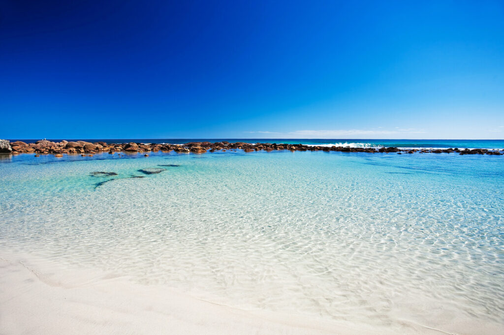 Pristine turquoise lagoon and white sand beach on Kangaroo Island — a dreamy spot for couples wondering where to honeymoon in Australia for secluded, romantic escapes.