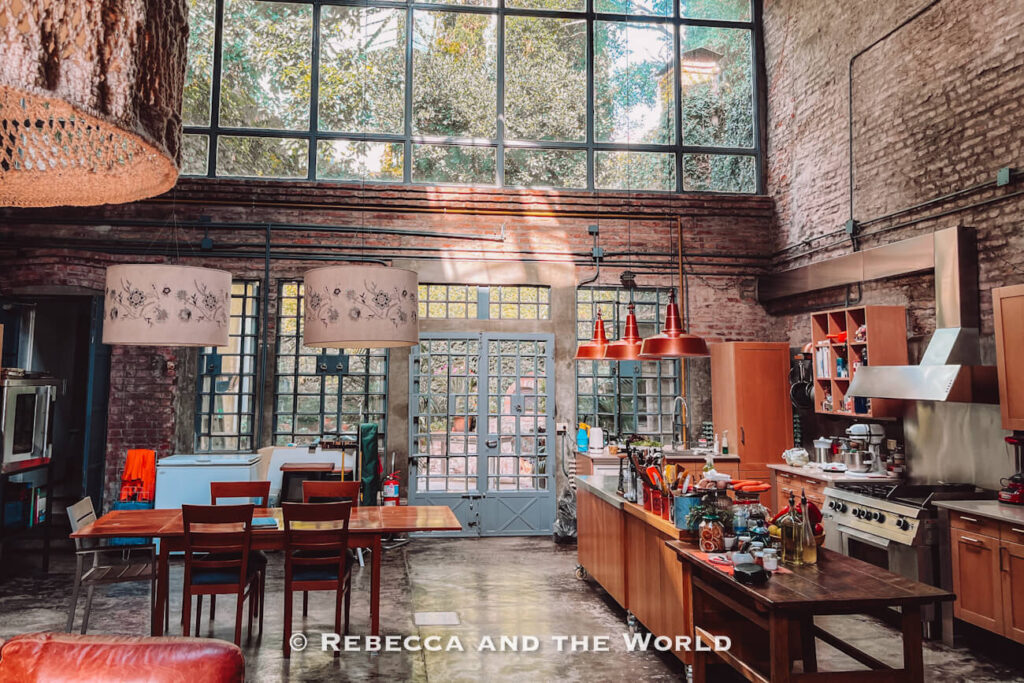 Spacious industrial-style kitchen and dining area at Asado Adventure, where guests gather during this Buenos Aires asado experience.