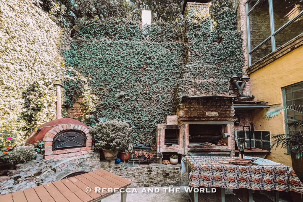 Rustic courtyard with parrilla and wood-fired oven at Asado Adventure, the setting for this relaxed Argentine asado experience in Buenos Aires.