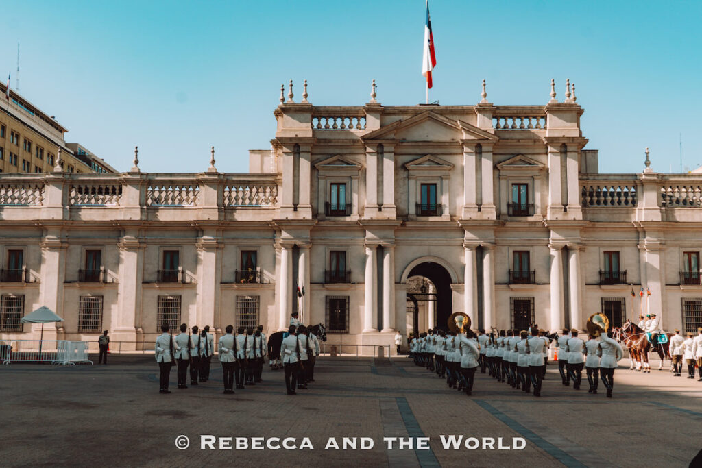 Uniformed guards march in formation in front of La Moneda Palace, Chile’s presidential building, during the Changing of the Guard ceremony—one of the iconic Santiago top attractions and a key sight when planning what to do in Santiago.