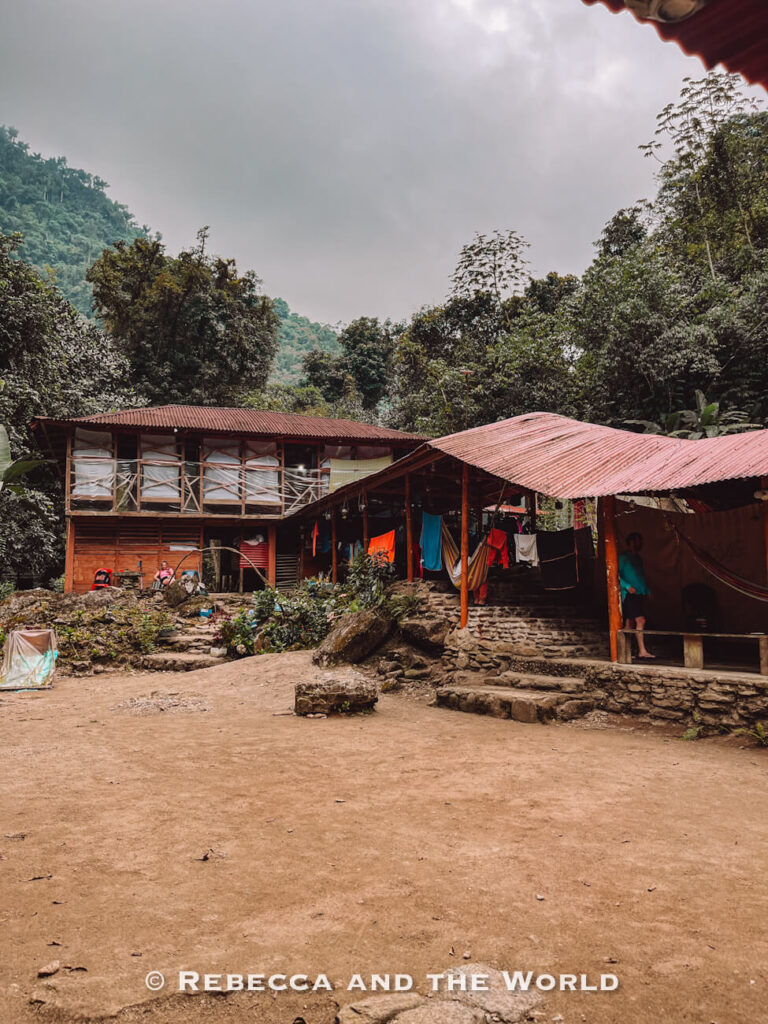 Rustic wooden trekking camp with red metal roofs deep in the jungle along the Ciudad Perdida trek route.