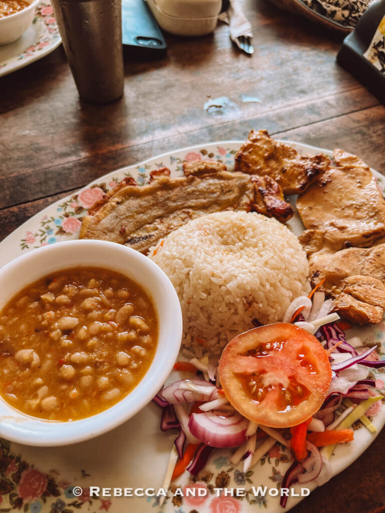 Traditional Colombian meal with rice, beans, grilled meat, plantain, and salad served during the Ciudad Perdida hike.