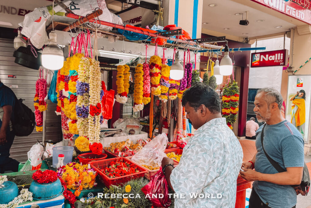 Customers buying colourful garlands made from marigolds, jasmine and roses at a flower stall in Singapore’s Little India neighbourhood.