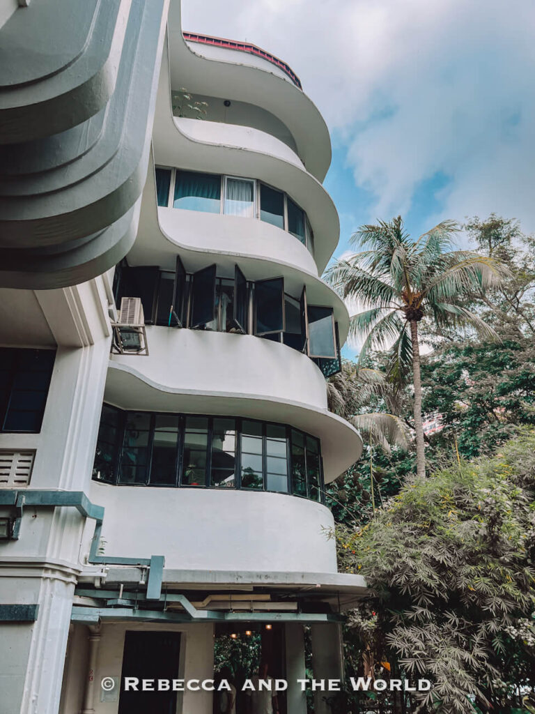 Close view of the sweeping curved balconies and rounded windows of a white Streamline Moderne apartment block in Tiong Bahru.