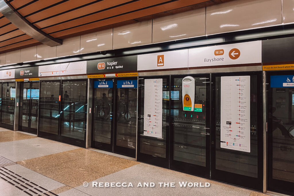 Platform screen doors, route maps and signs inside Napier MRT station on Singapore’s Thomson-East Coast Line.