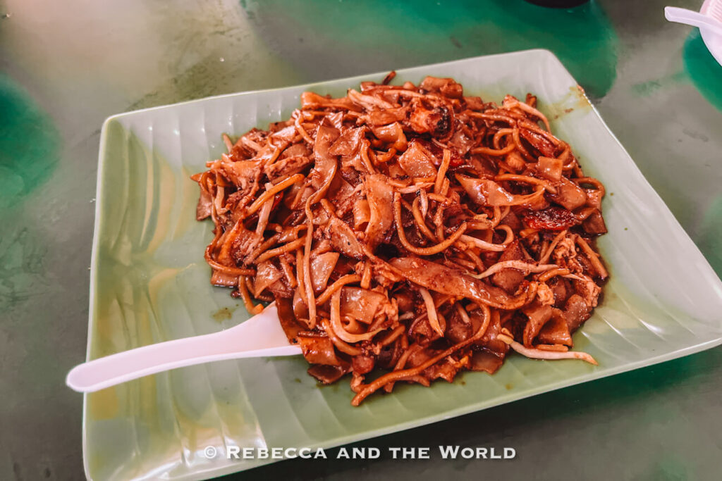 A plate of char kway teow, Singapore's stir-fried flat rice noodle dish, from a Chinatown hawker stall