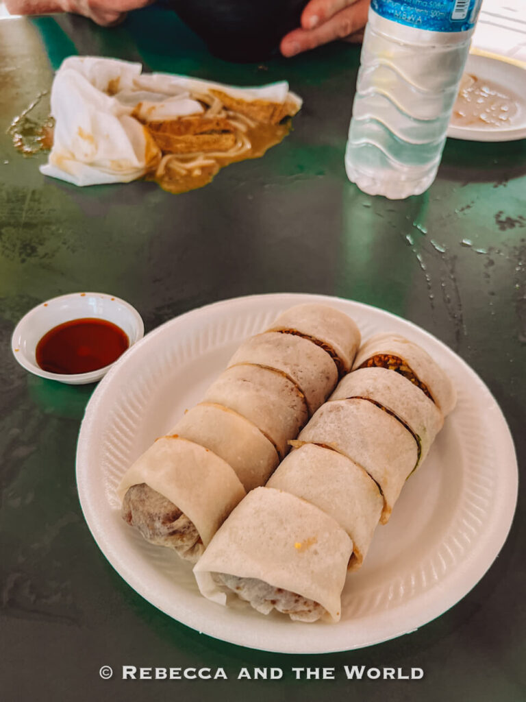 Sliced popiah, Singapore's fresh spring roll filled with turnip and vegetables, served with chili sauce