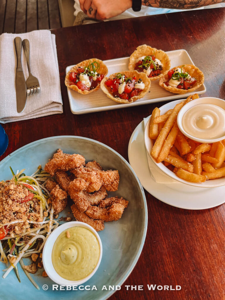 Fish, papaya salad and chips served at a Palm Cove restaurant, a favourite lunch stop on the Cairns to Port Douglas drive