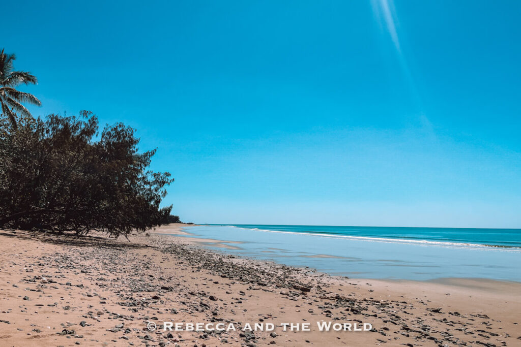 Quiet, rocky stretch of sand at Oak Beach, a peaceful stop along the Great Barrier Reef Drive between Cairns and Port Douglas