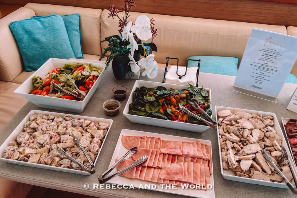 Buffet lunch spread of salads, sliced ham and chicken served on board the Sailaway catamaran during the Great Barrier Reef day trip