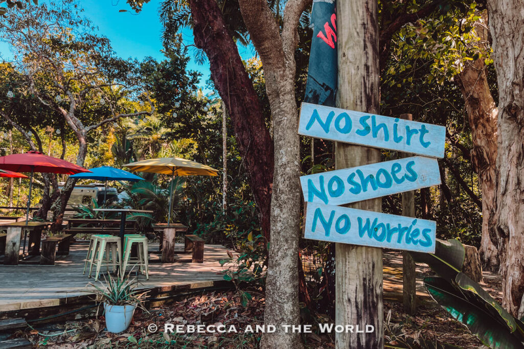 Laid-back "no shirt, no shoes, no worries" sign capturing the relaxed vibe of Cape Tribulation